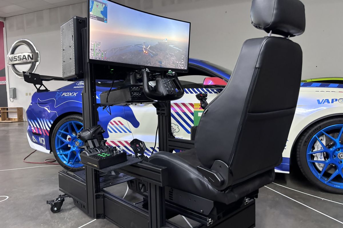 Academy flight simulator rig with stick, yoke, throttle quadrant and rudder pedals